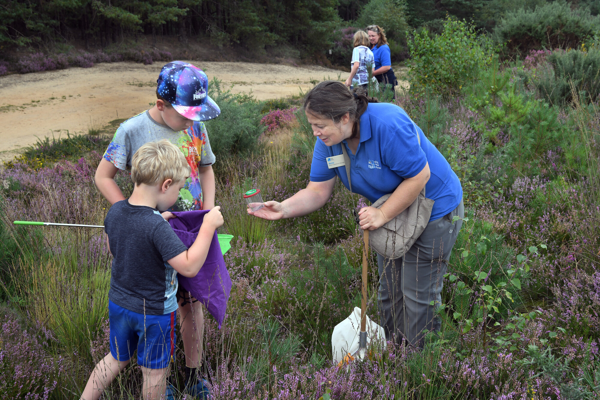 A child bug catching in the chalk grasland of the the South Downs National  Park - South Downs National Park Authority